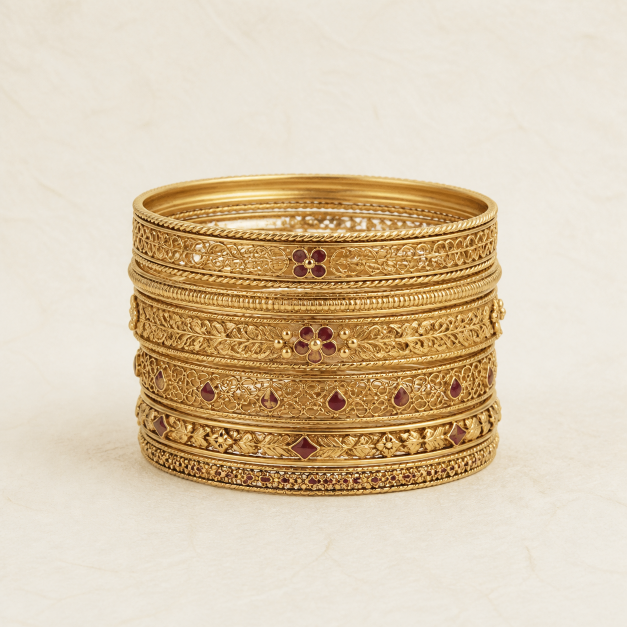 Stack of handcrafted gold bangles